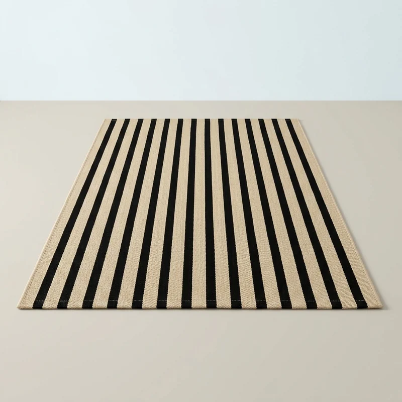 OJIA black and tan striped washable outdoor porch rug at a front door